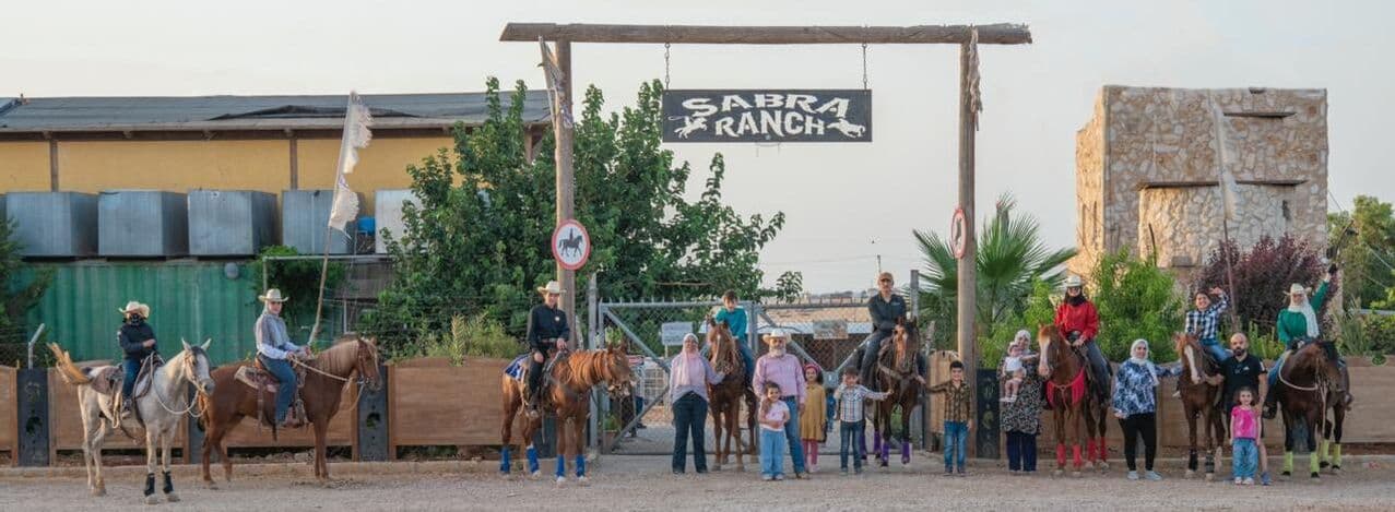 The Sabra family at the ranch gate